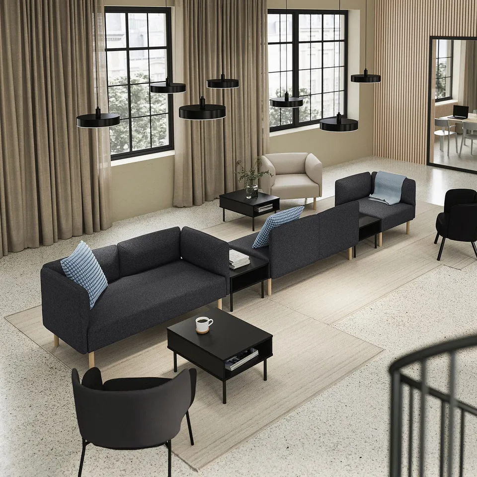 Modern living room with large LILLEHEM grey fabric sofa set, black coffee tables, and black pendant lamps.