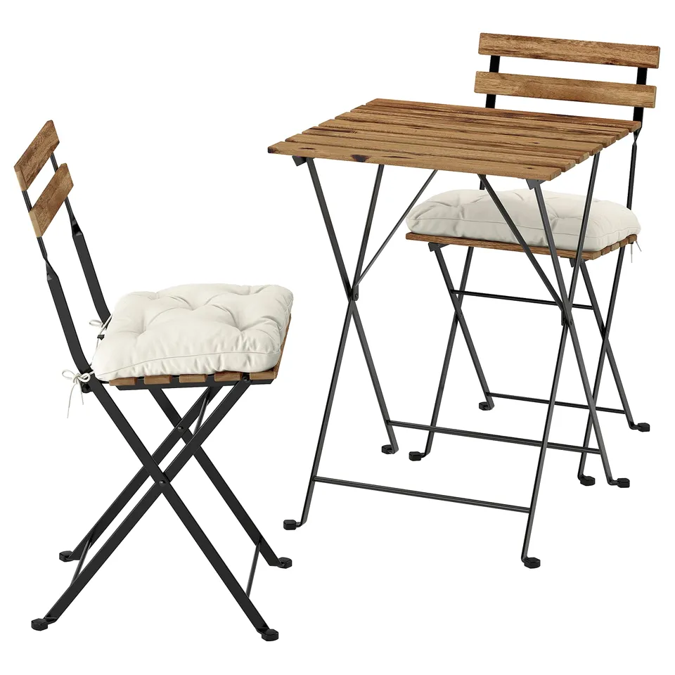 Wooden chairs and table set. Beige cushions. Foldable black metal frames.