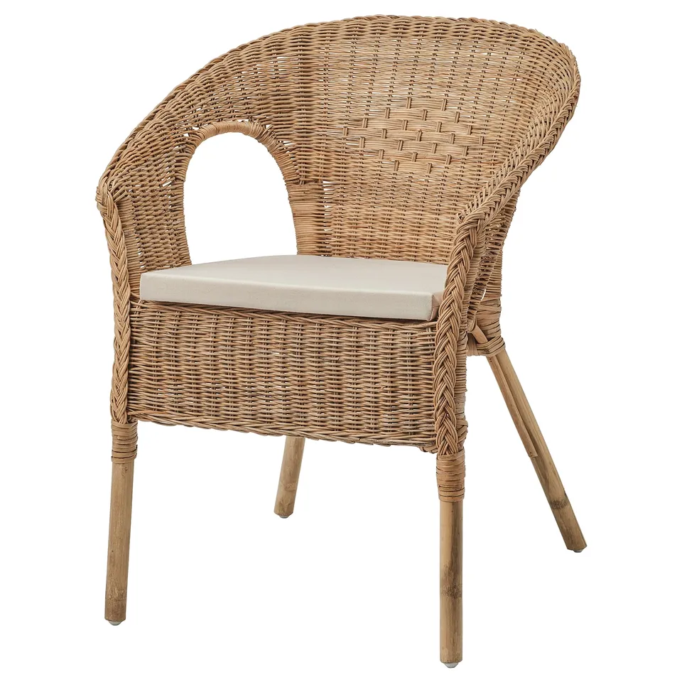 An AGEN wicker chair, light brown, with a curved back and seat cushion.