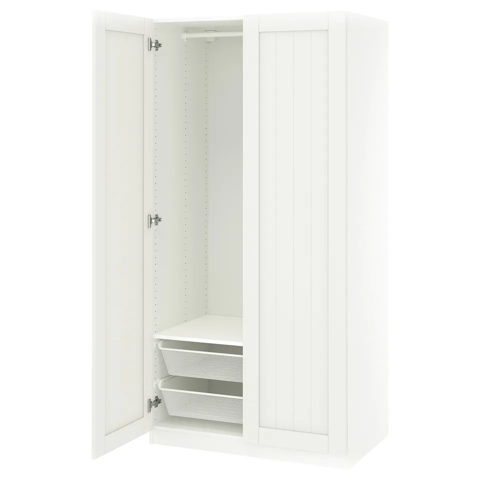 White PAX wardrobe with open door showing mesh baskets; minimalist design.