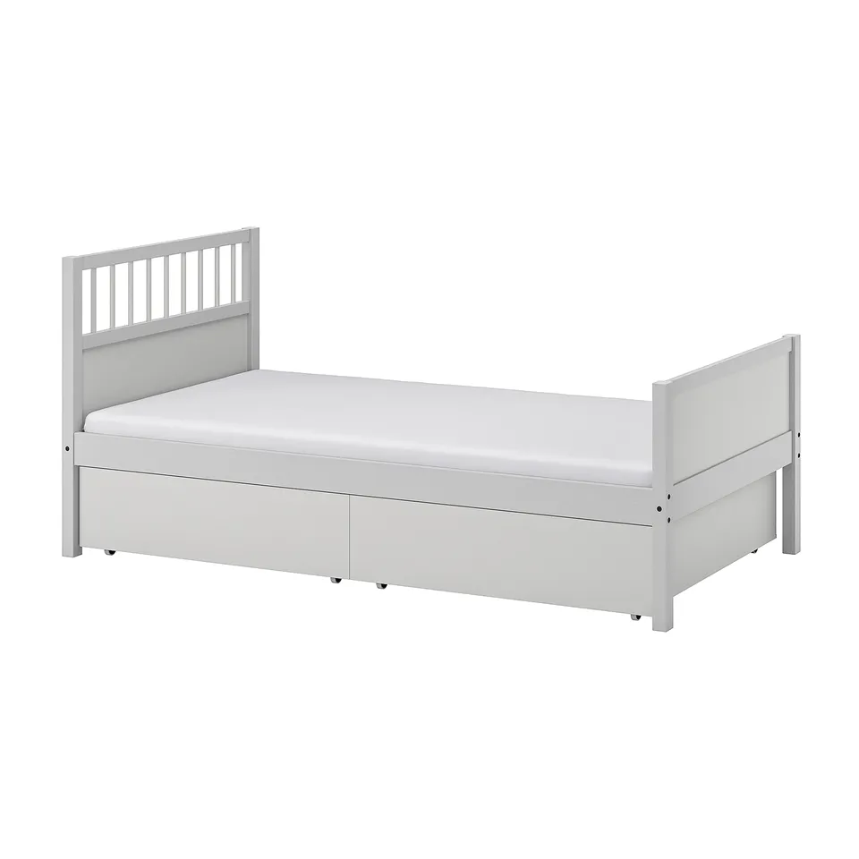 SMYGA white wooden bed frame with drawers and vertical headboard slats.