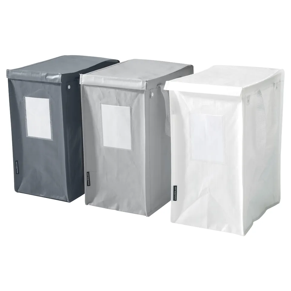 Three DIMPA waste sorting bags in black, grey, and white with handles and label pockets. Square, durable plastic design.