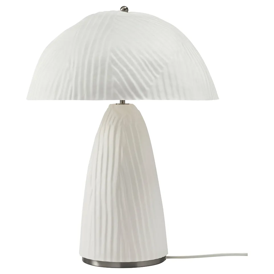 A white VINDKRAFT lamp with a ribbed design, featuring a dome shade and cylindrical base made of moulded paper pulp.