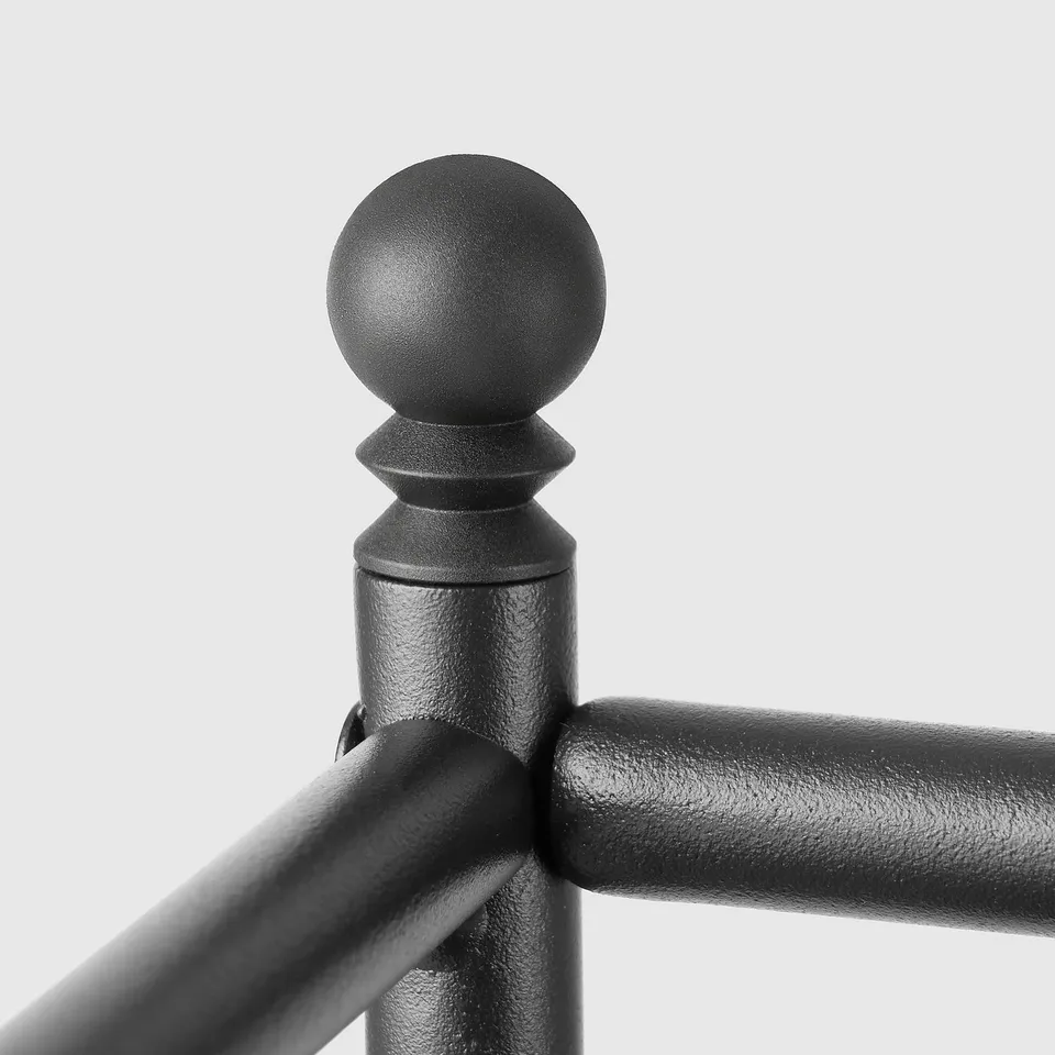 Black metal fixture with a decorative sphere, showcasing high-quality craftsmanship and finish.