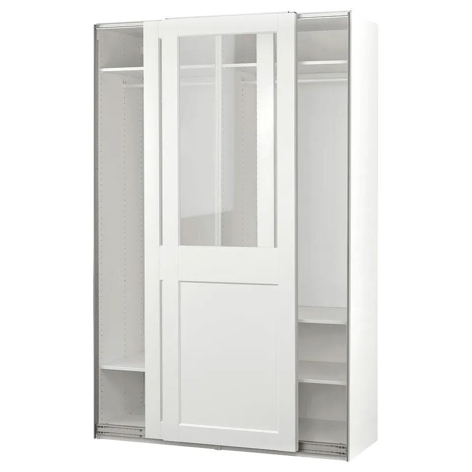 A white PAX wardrobe with glass doors. It sliding doors, adjustable shelves, and ample storage.