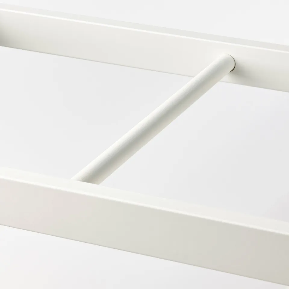 White metal clothes rail, securely attached to wardrobe frame, sleek and minimalist design.