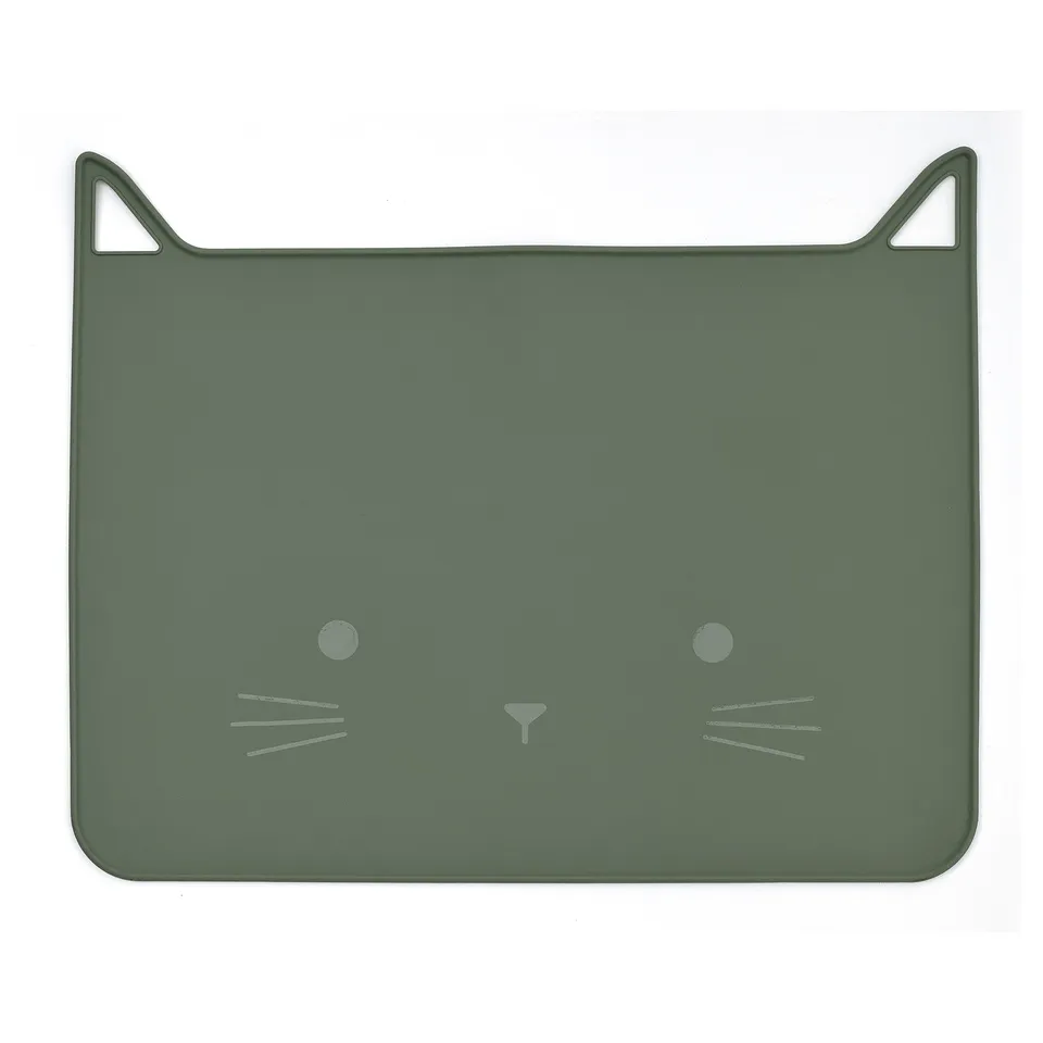 A green, cat-designed silicone place mat, perfect for protecting tables from messes.