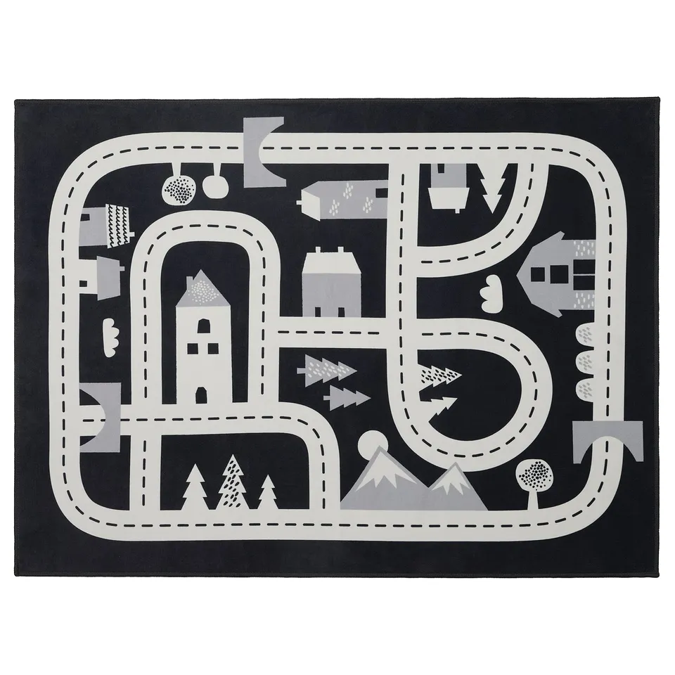 Black and white play rug with roads, houses, and trees. Circular and rectangular shapes, made from recycled polyester.