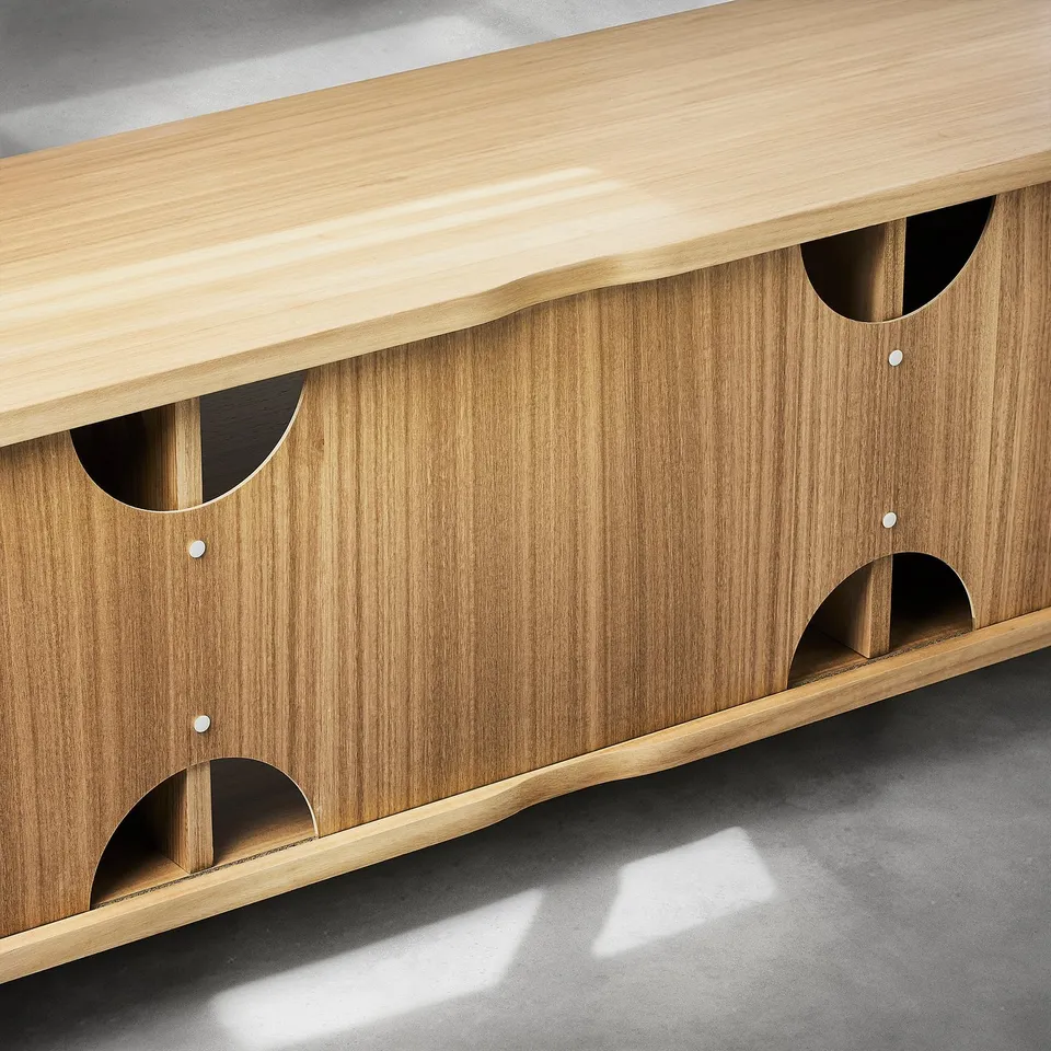 Wooden tv bench with open sections, featuring curved cutouts and a natural finish. Adjustable feet ensure stability.