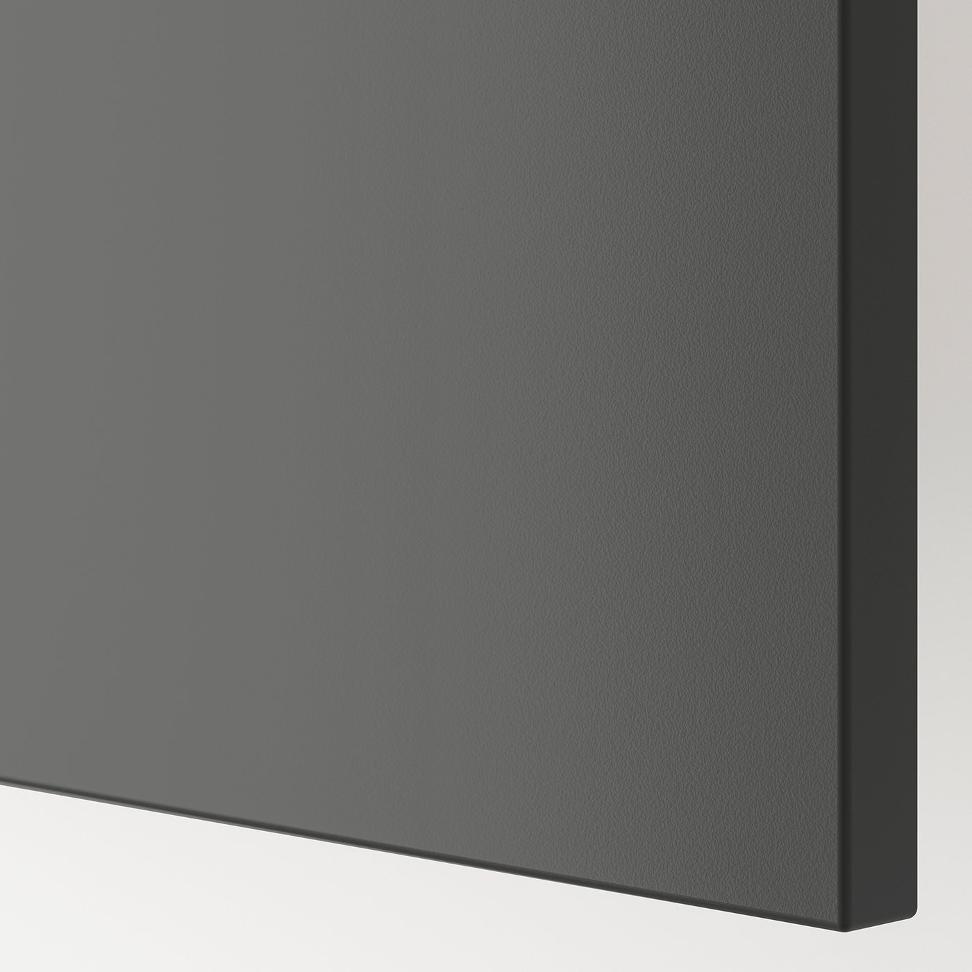 Close-up of BESTÅ tv benchs sleek, smooth dark grey surface, showcasing its modern and sturdy design.