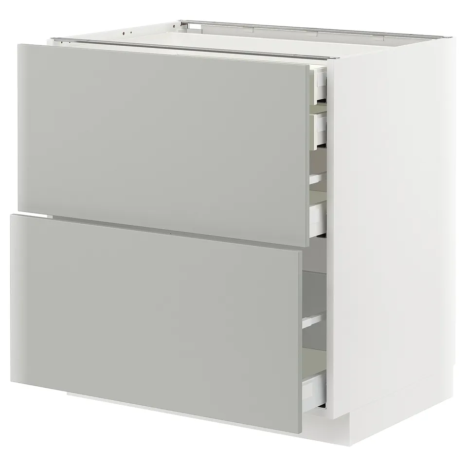 Modern light grey kitchen cabinet with multiple drawers.