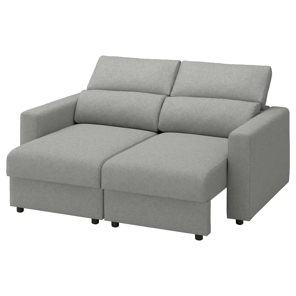 Light grey, l-shaped couch with pull-out bed, modern design, sturdy fabric.