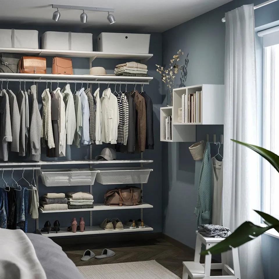 Organised closet with clothes, shelves, & storage. Ceiling spotlight, RÖKFRI, illuminates neatly arranged items. White, small, modern design.