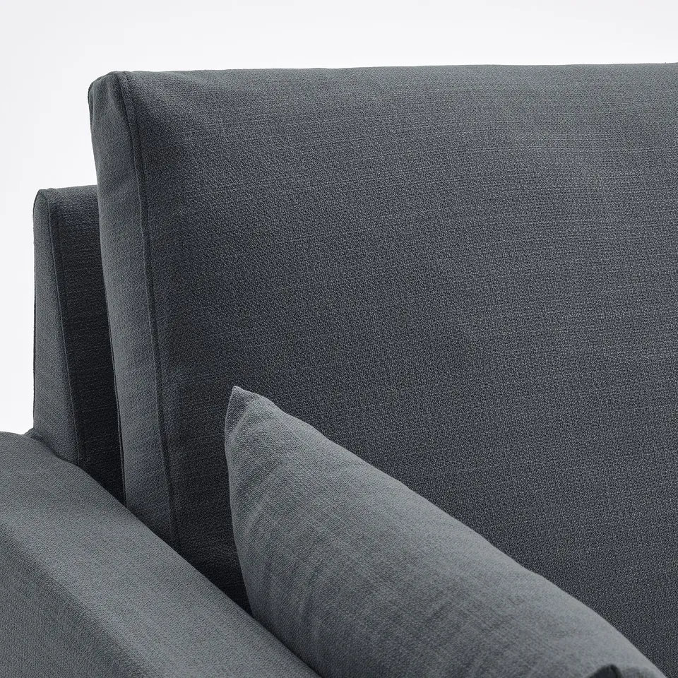Soft, grey fabric sectional sofa with plush cushions; high-quality, comfy design.