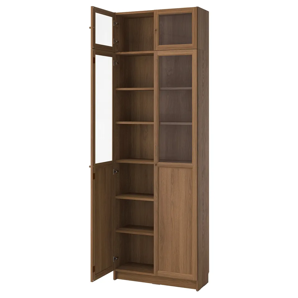An empty wooden tall bookcase with glass doors.