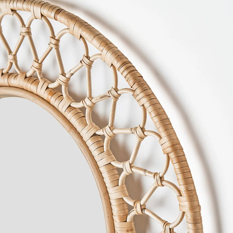 Weaved rattan mirror, natural & intricate pattern, handcrafted quality, light beige tone.