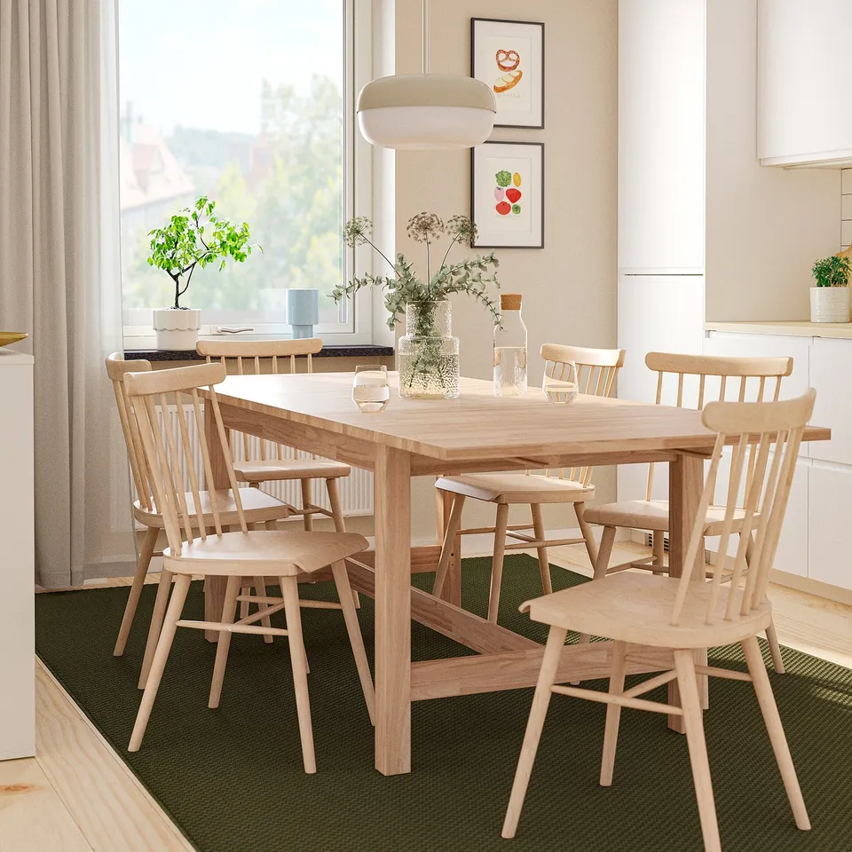 Wooden KARSKÄR dining set with chairs, table decor near window.