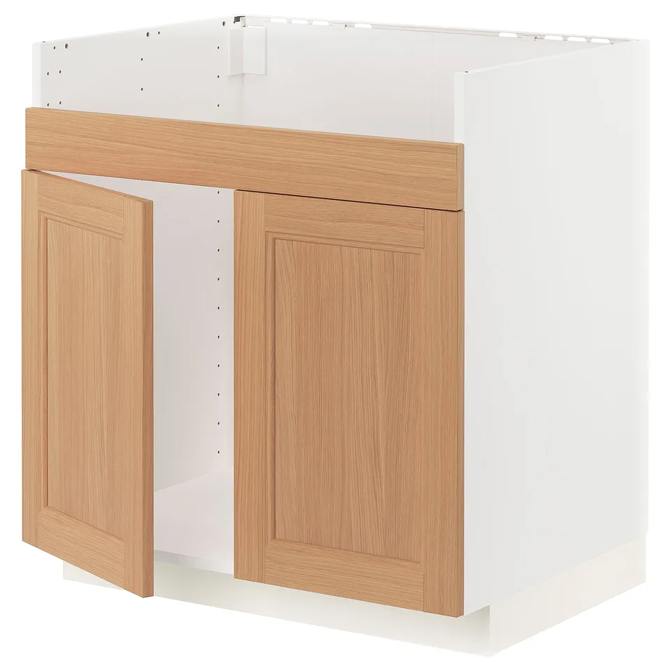 A white METOD kitchen cabinet with oak doors, featuring a modern design with natural wood grain.