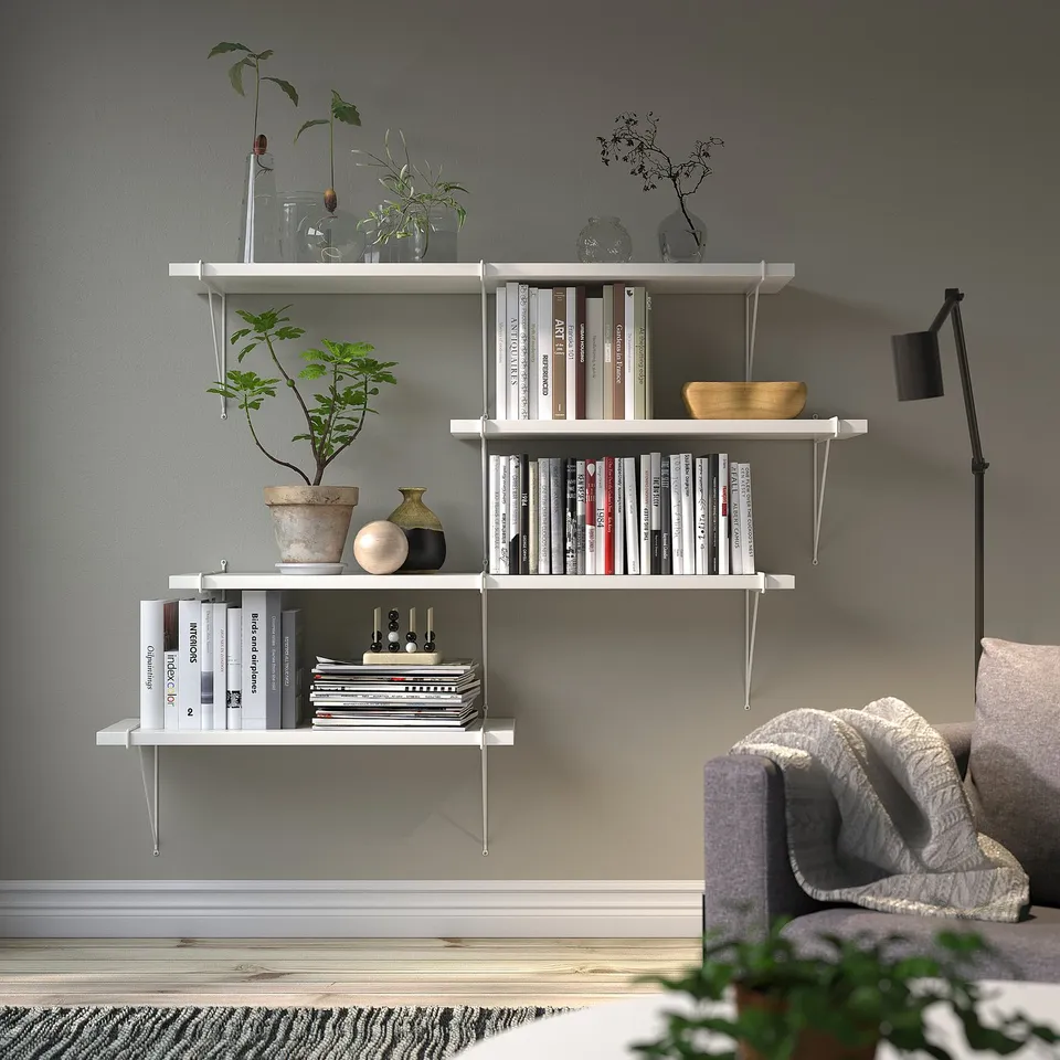 BERGSHULT wall shelf with books, plants, and brackets. Minimalist and elegant.