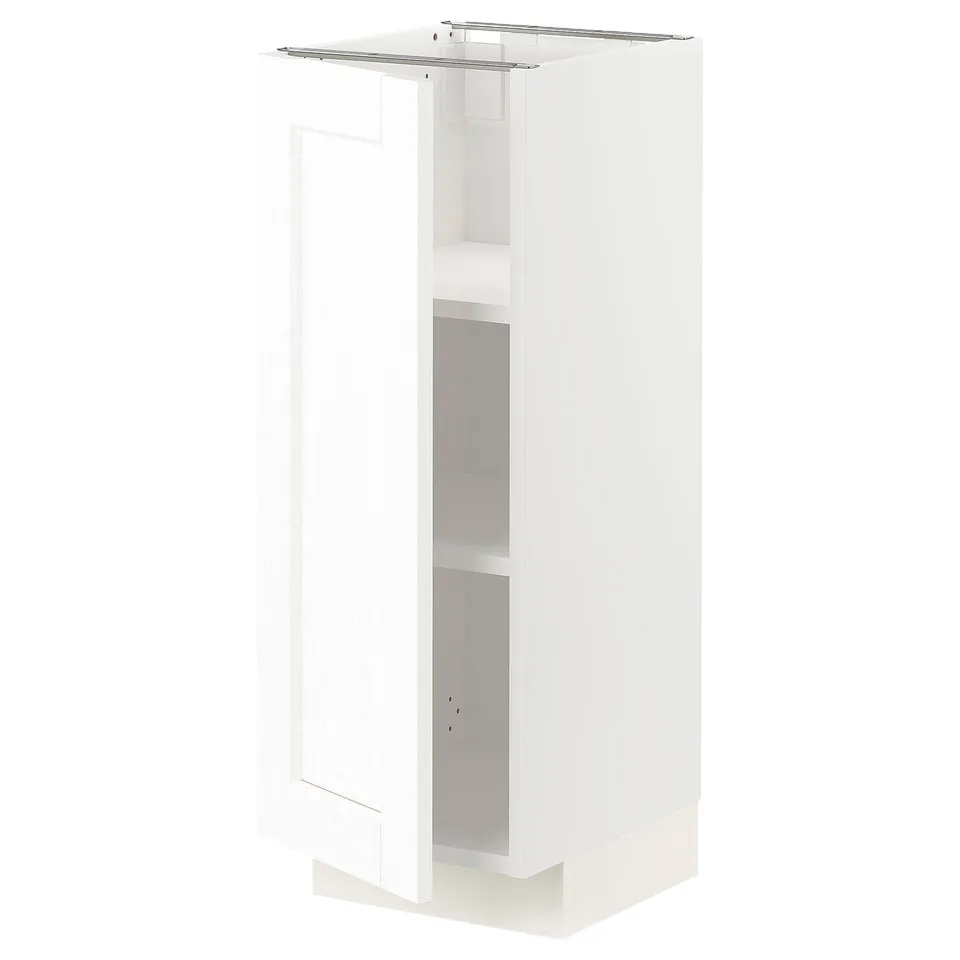 A white METOD kitchen cabinet with a sleek, modern design. It a fibreboard and plastic construction with adjustable shelves.