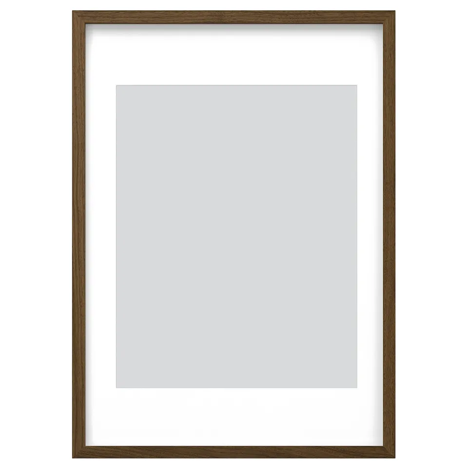 Brown wooden picture frame with white mat, rectangular shape, simple modern design.