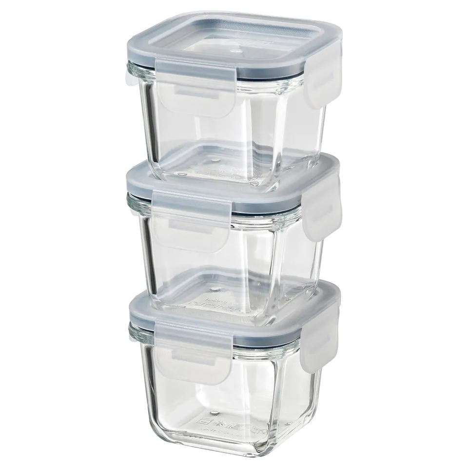 Three stacked clear square IKEA 365+ food containers with blue lids.