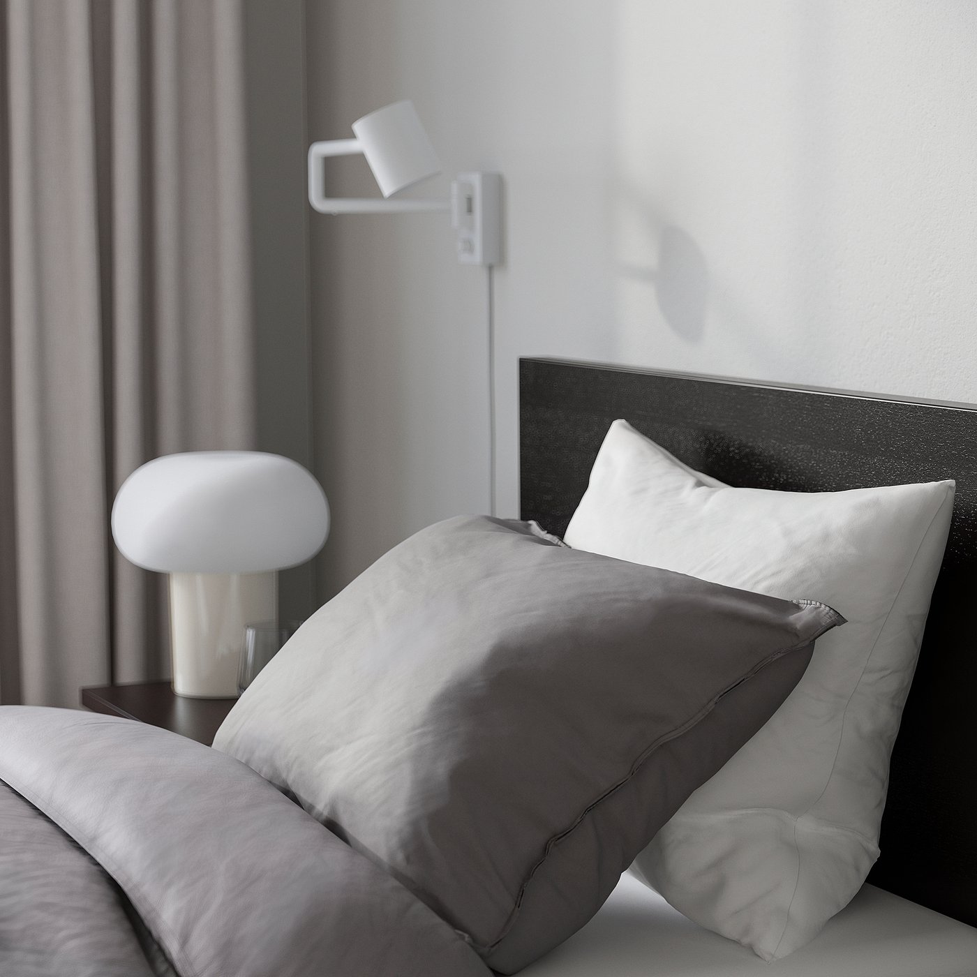 Bedroom scene with modern bed, grey sheets, white pillows, round white lamp on bedside table, curtains, and wall-mounted light.