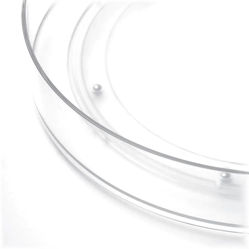 Clear plastic turntable with smooth edge; holds items securely.