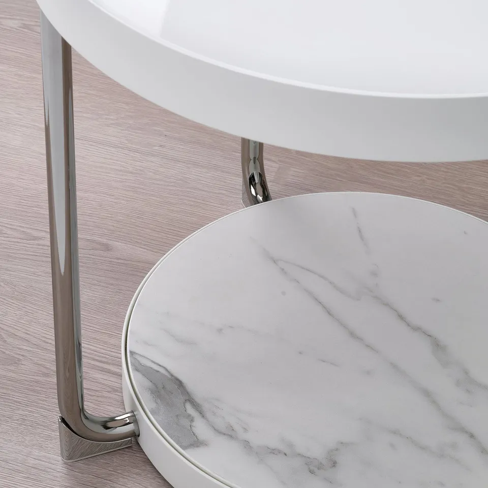 Circular glass table with chrome legs, showcasing high-quality, sleek, and modern design.