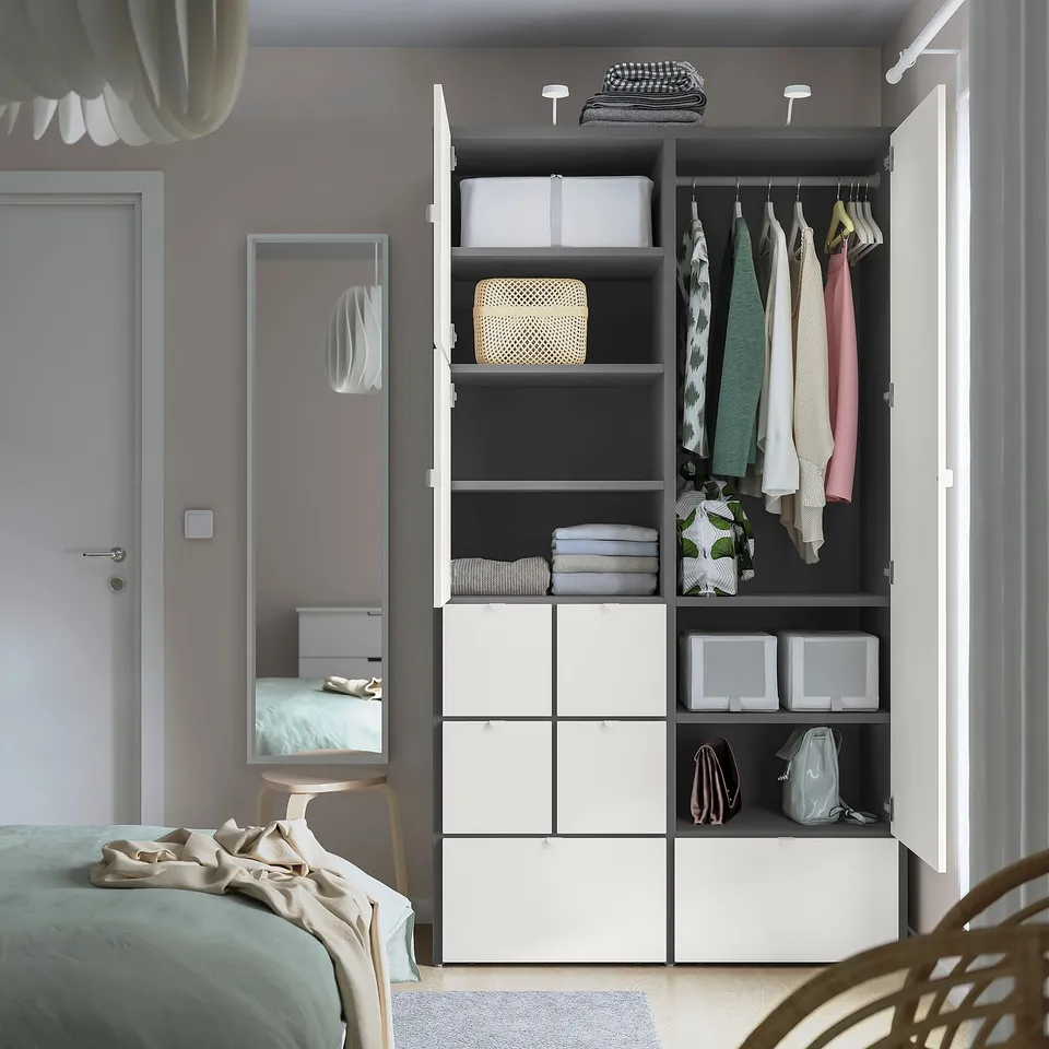 Modern closet with drawers, shelves, and hanging space. Includes adjustable feet and smooth-running drawers.
