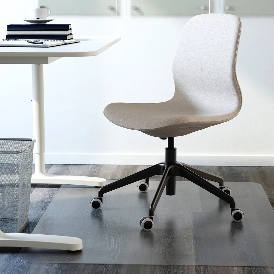 White office chair with tilt function and height-adjustable seat under minimalist desk.