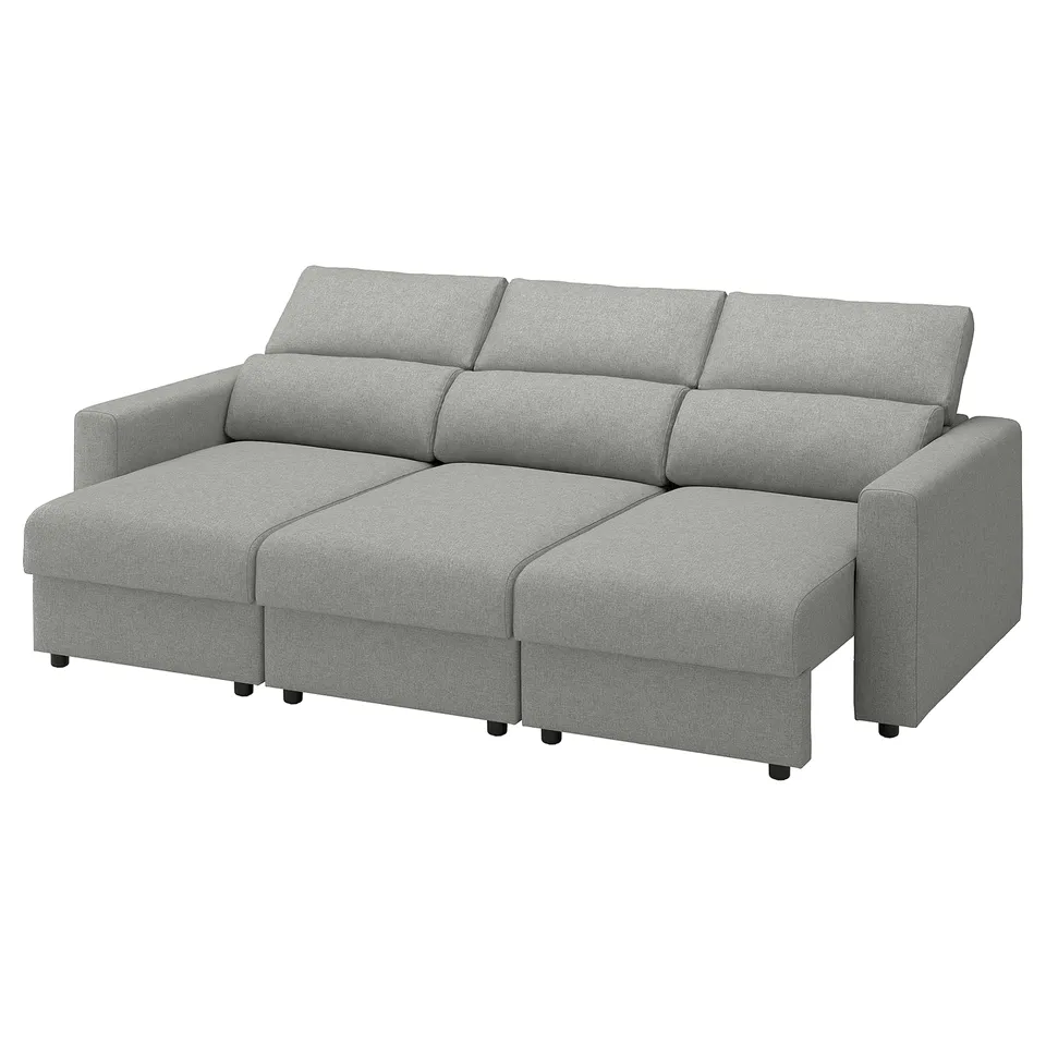 Modern grey sofa with chaise, sleek design, inviting for relaxation.