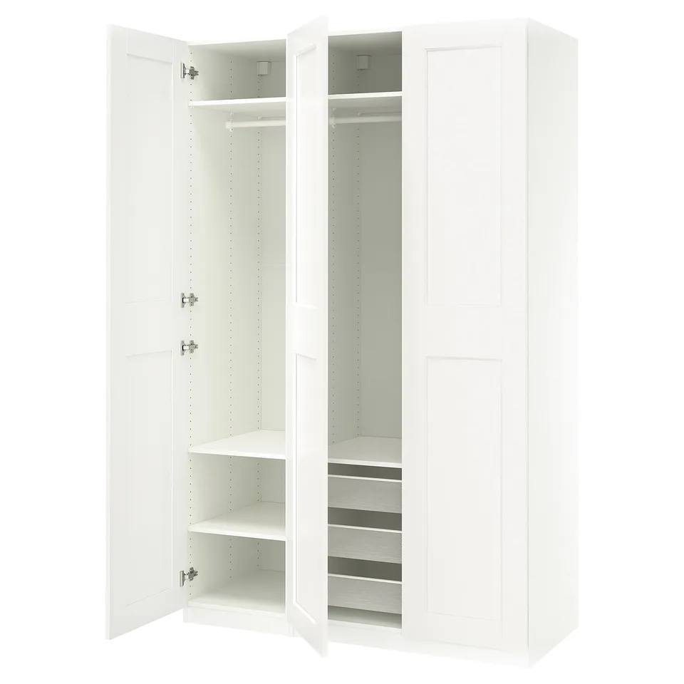 A white IKEA PAX wardrobe with shelves and drawers, featuring a sleek, modern design.