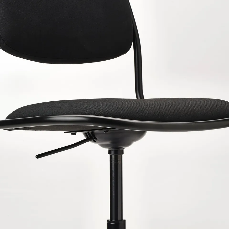 Black office chair with adjustable height and brake castors.