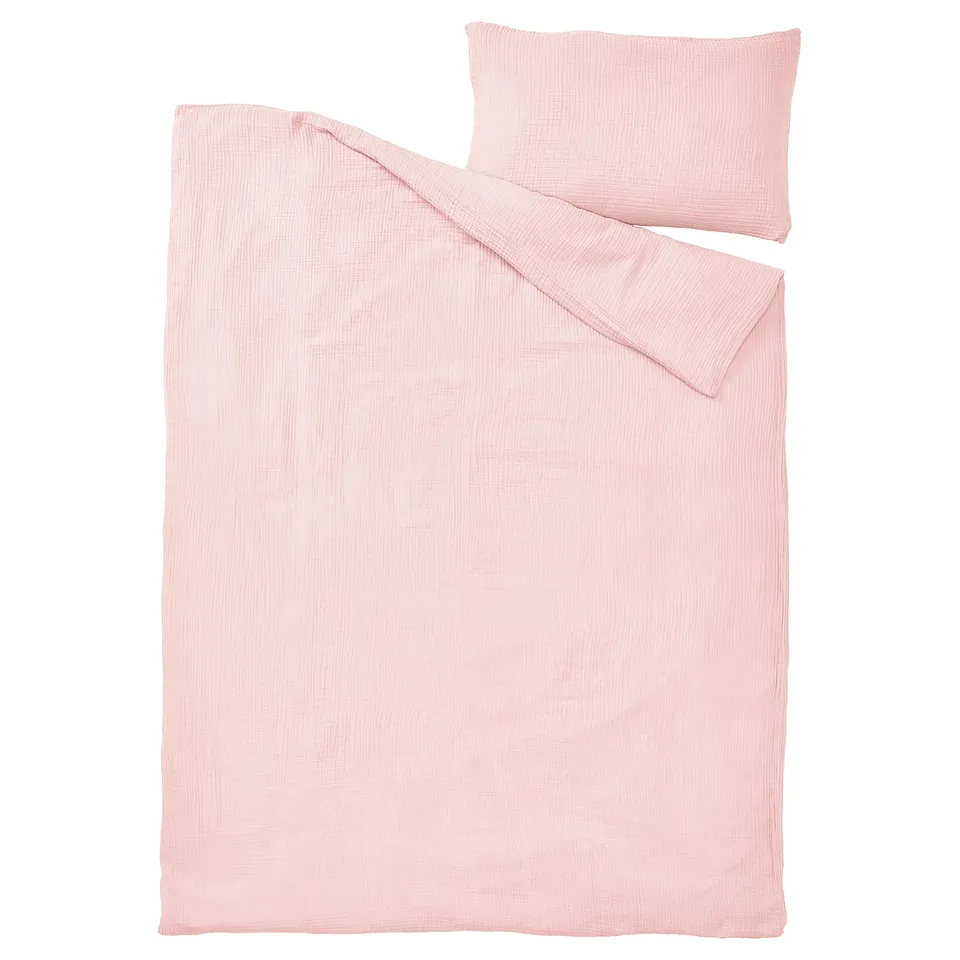 A light pink SCHERSMIN bedding set with duvet cover and pillowcase, made of soft organic cotton.