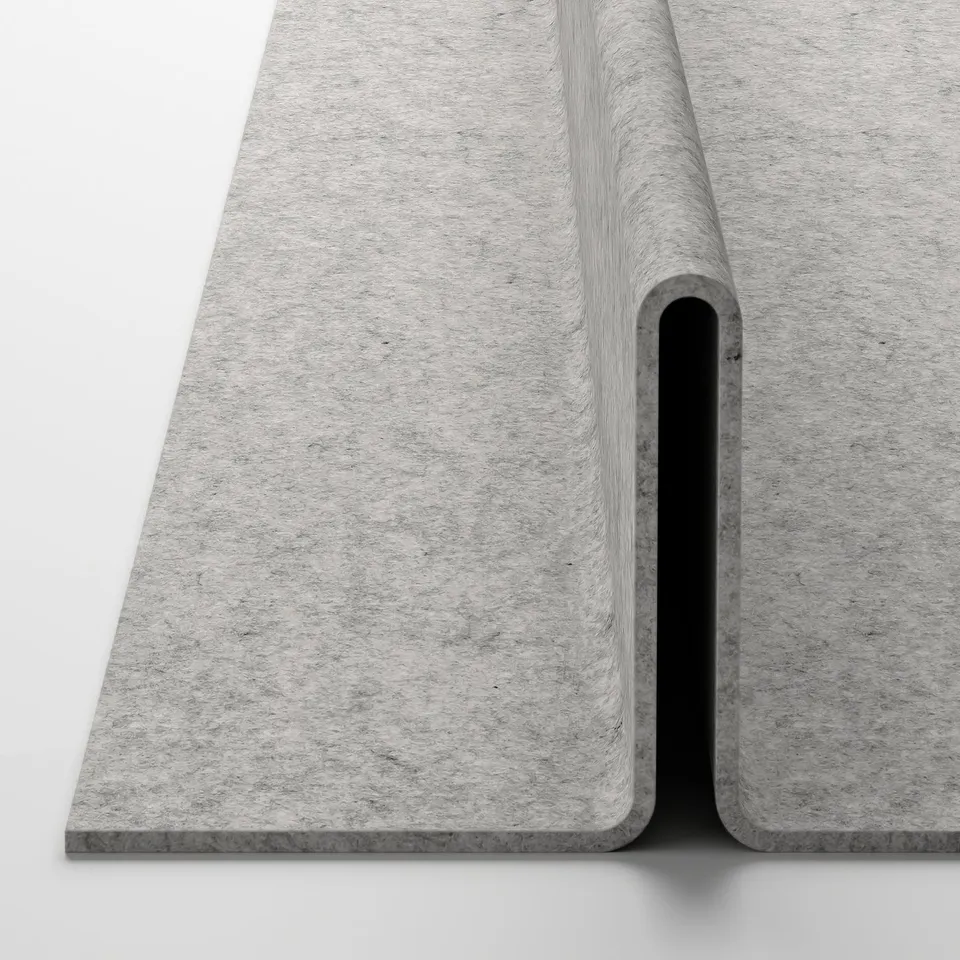 Knitted grey fabric mat folded neatly, showcasing its durable, textured quality.