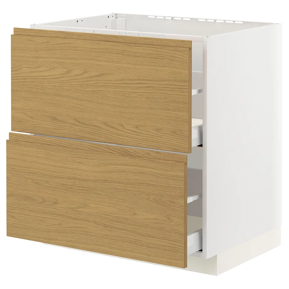 A METOD kitchen cabinet with oak-colored voxtorp drawers and white sides, designed for built-in appliances or a kitchen sink.