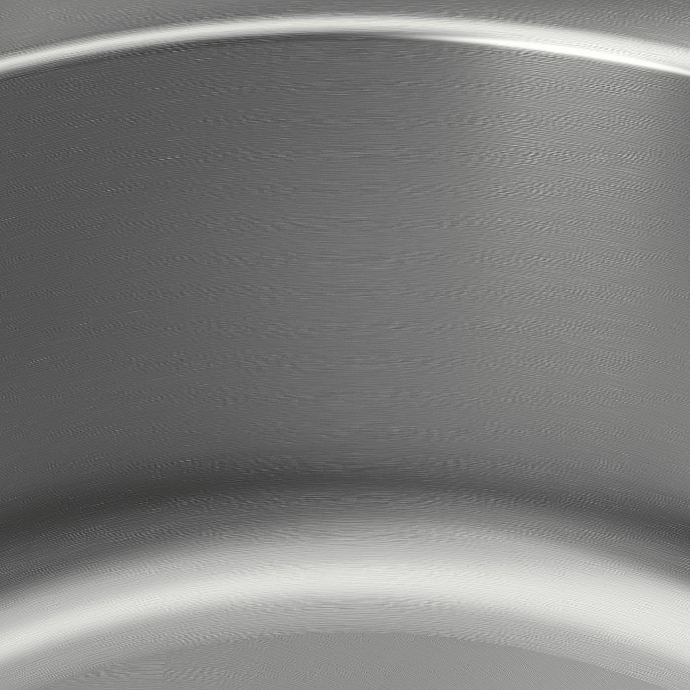 Stainless steel sink close-up, smooth texture, sleek surface reflecting light, emphasising quality and durability.