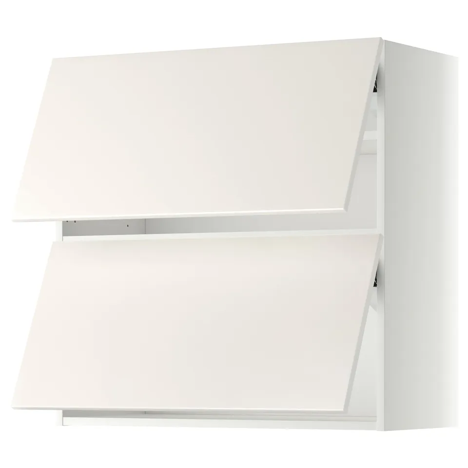 A white METOD kitchen cabinet with smooth, clean-line design and gentle door closing hinges.