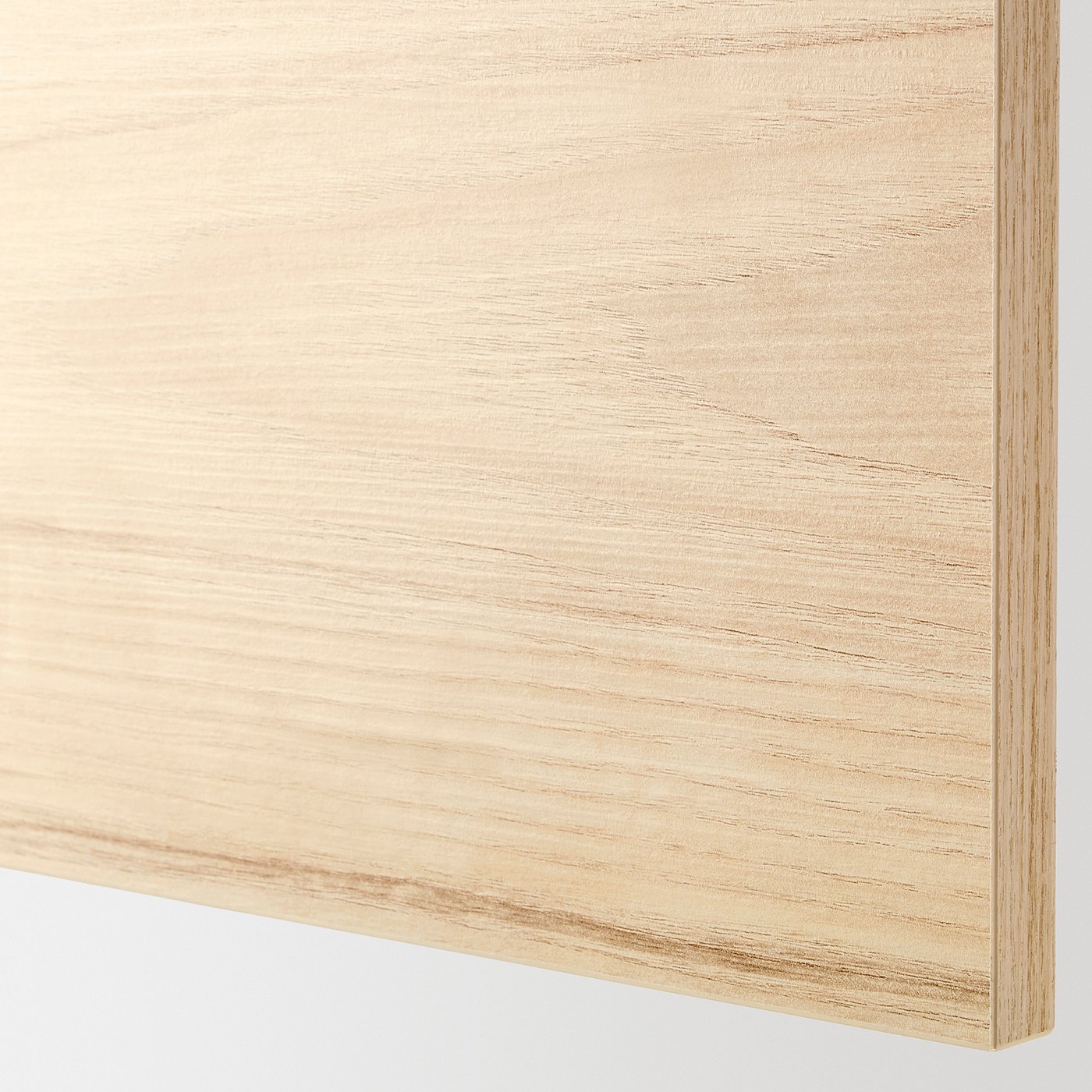 Close-up of light wood textured surface, smooth and natural, showing quality and finish of METOD kitchen system with askersund fronts.