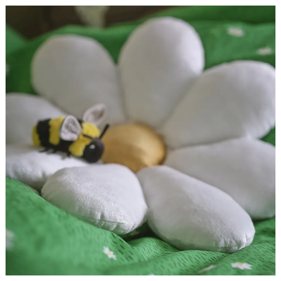 Soft, plush flower-shaped cushion with toy bee; high-quality, recycled materials.