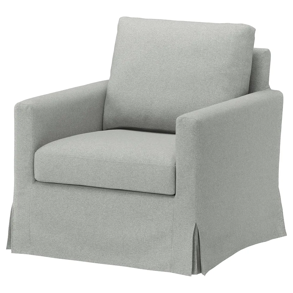 A grey fabric-covered armchair with a square back and curved armrests. It has a cosy and inviting design.