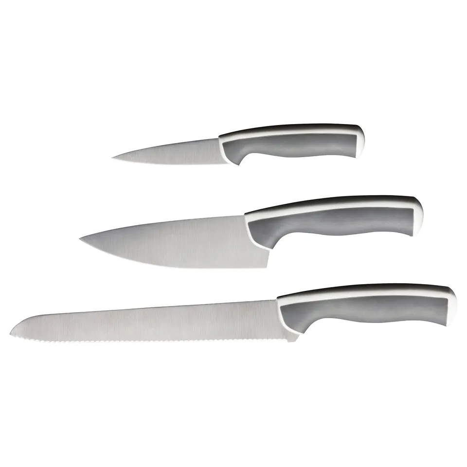 Displays three stainless steel knives with grey handles, arranged neatly.