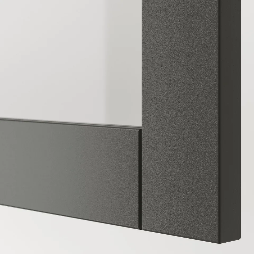 Close-up of a dark grey IKEA BESTÅ cabinet corner, showcasing smooth, sturdy finish and crisp edges.
