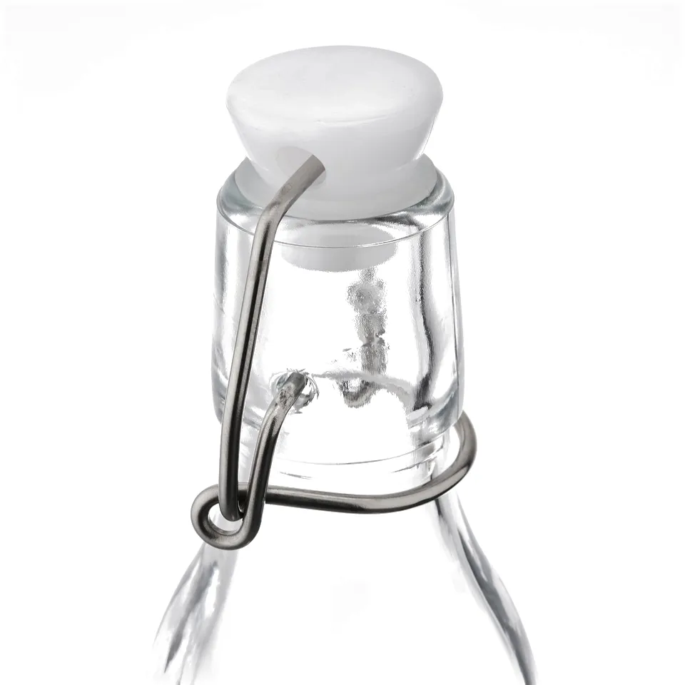 A clear glass bottle with a secure, white rubber stopper and a metal clasp.
