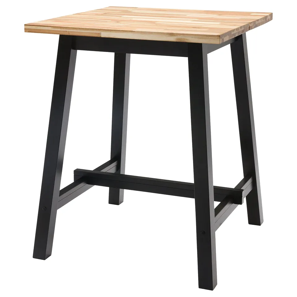 SKOGSTA table: square light wood top, dark metal legs, sturdy design.