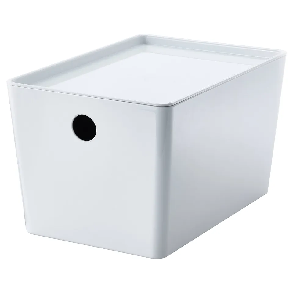 A white KUGGIS storage box with a round black handle. Its rectangular, made of recycled pet plastic.