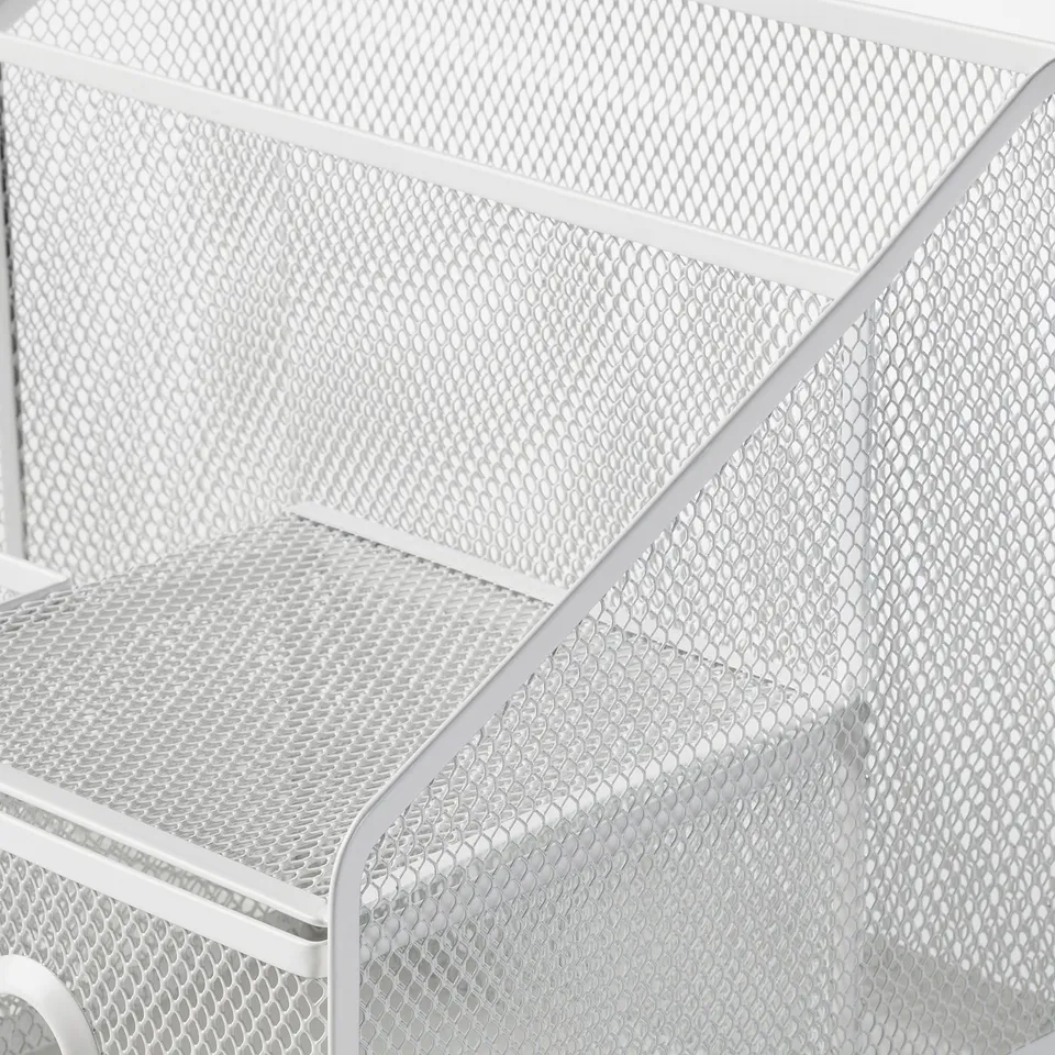 Close-up of white metal mesh storage basket with diamond pattern, sturdy and well-constructed.