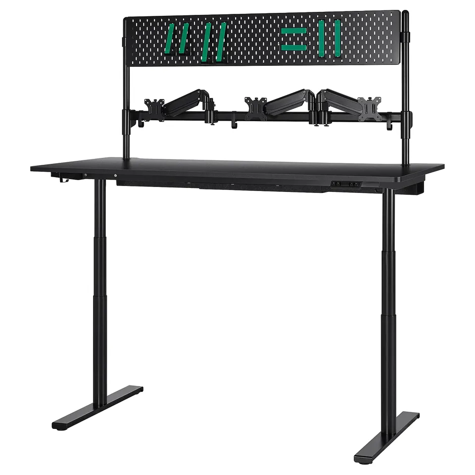 Black adjustable gaming desk with perforated top, 3 monitor arms, and sit/stand feature.
