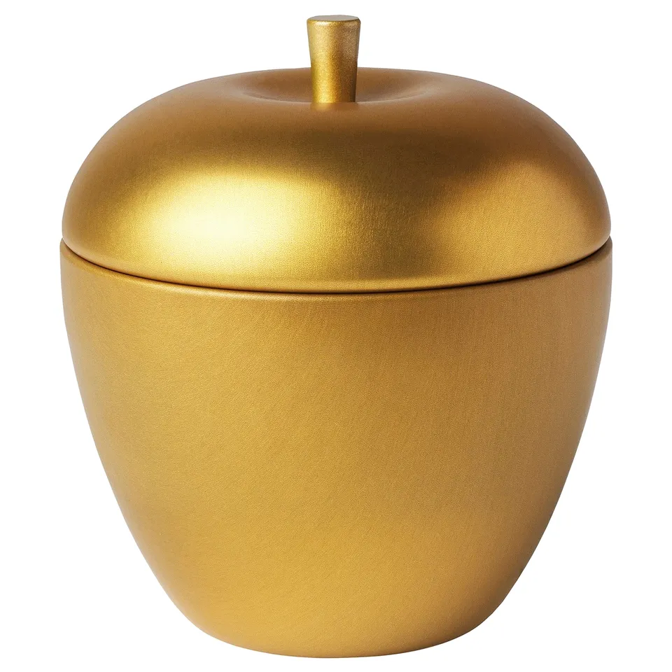 Gold-colored apple-shaped container with a lid, crafted from tin-plated steel. A decorative, functional storage jar.